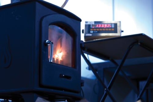 Furnace with a burning solid fuel inside